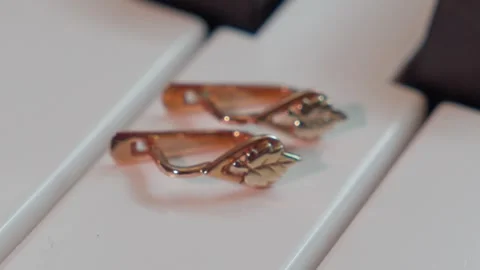 Earrings On Piano Keys Focus Pull Stock-Footage 342706537