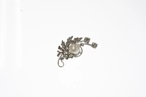 Earrings on plain white background. Stock Photos