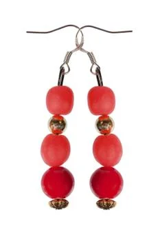 Earrings of red beads with gold elements on a white background Foto stock