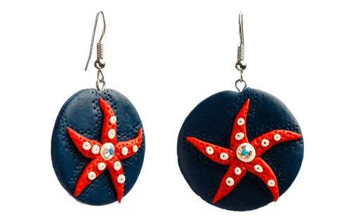 Earrings on white Stock Photos