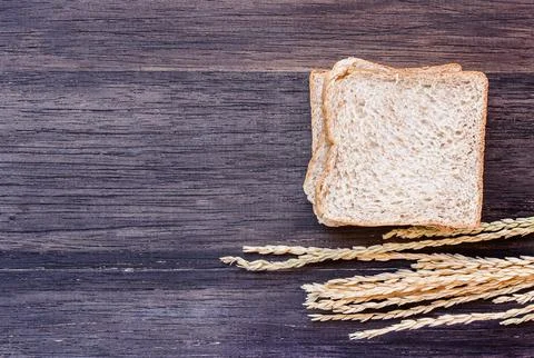 Ears of wheat and slice of bread Stock Photos