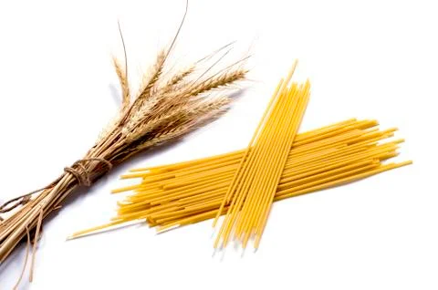 Ears of wheat and two linking of spaghetti Stock Photos