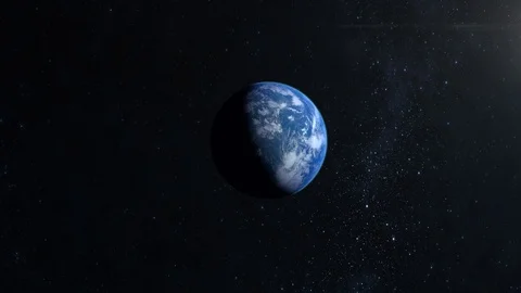 The earth is approaching and moving left. The camera flies around. A view from Stock Footage 106464529