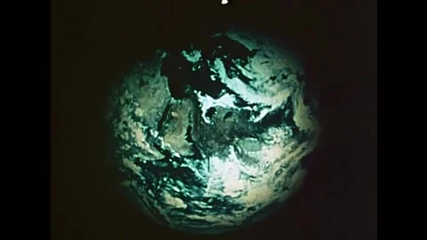 The Earth can be seen from space. People buy books and read in a library in Stockbeeldmateriaal 157263789