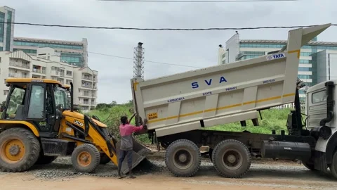 An earth excavator machine at work for road construction Video stock 167698664