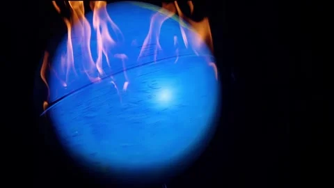 The earth with fire rotating on black Stock Footage 252129701
