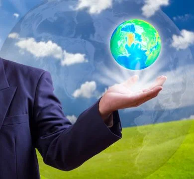 Earth globe in hand Stock Photos
