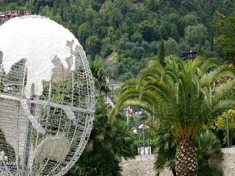 Earth globe with lighting and palms Stock Footage 78627093