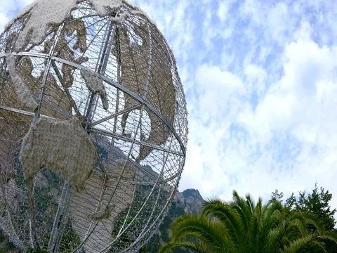 Earth globe with lighting and palms 1 Stock Footage 78628041