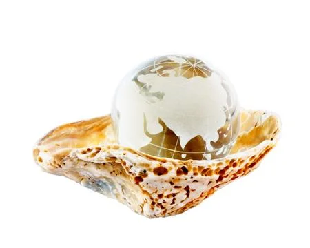 Earth globe in seashell Stock Photos