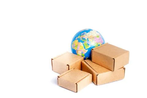 Earth globe is surrounded by boxes isolated on white background. Global busin Stock Photos