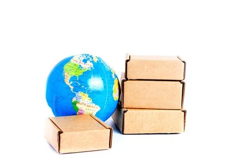 Earth globe is surrounded by boxes isolated on white background. Global busin Stock Photos