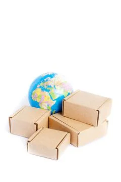 Earth globe is surrounded by boxes isolated on white background. Global busin Stock Photos