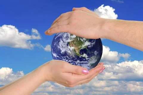 Earth in hands Stock Photos