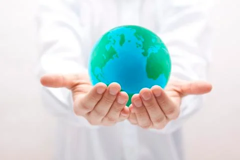 Earth in hands Stock Photos