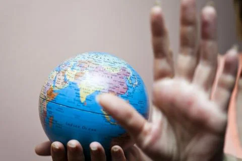 The earth in hands Stock Photos