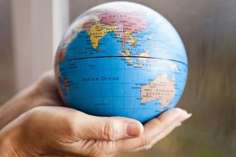 The earth in hands Stock Photos