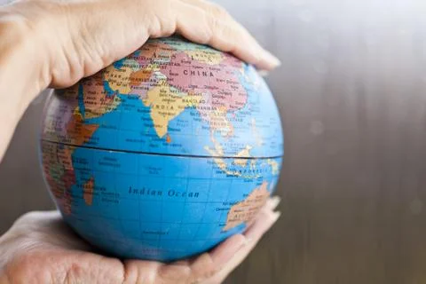 The earth in hands Stock Photos