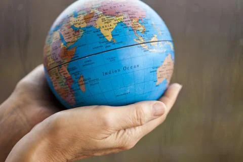 The earth in hands Stock Photos