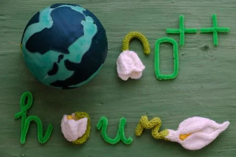 Earth hour message on green background Stock Photos
