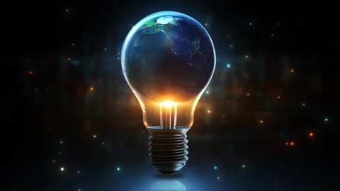 Earth inside a glowing light bulb representing green energy Stock Footage 347189043