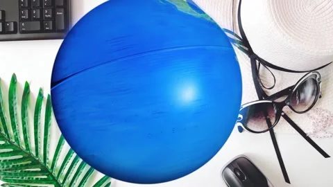 The earth, keyboard and hat on white Stock Footage 252135312