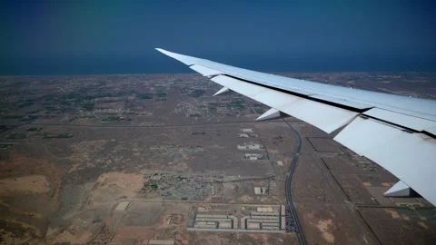 Earth land tiny city from top view airplane wing side during landing take off Stock Footage 255371626