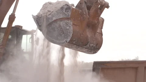 Earth mover loading dump truck slow mo Stock Footage 311089291