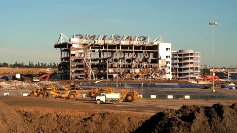 Earth movers at demolition site Stock Footage 86220224