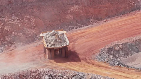 Earth-moving construction vehicle transporting large boulders. HD Stock Footage 241213643