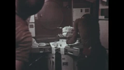 EARTH ORBIT - 1973: Back view - Skylab 2 crew works at wall panel 스톡 동영상 347642132