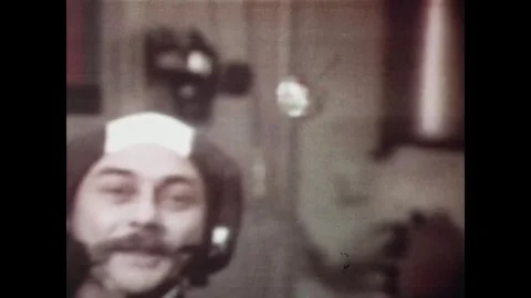 EARTH ORBIT - 1973: Camera view — Skylab 3 astronaut beside floating object Stock Footage 347865602
