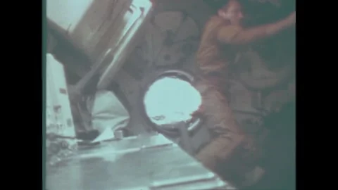 EARTH ORBIT - 1973: MDA work — Skylab 4 coverall sleeve borders opening Stock Footage 348024948