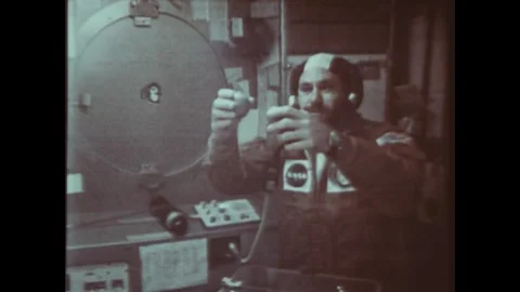EARTH ORBIT - 1974: Floating object — Skylab 4 Orbital Mechanics Hand Raised Stock Footage 347862959