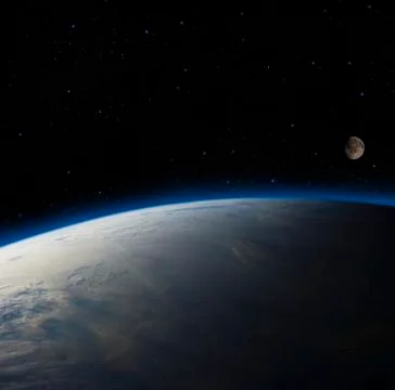 Earth overlooking the moon. Stock Photos