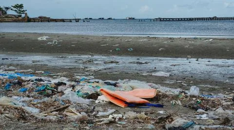 Earth Pollution Garbage Spread On The Beach Stock Photos