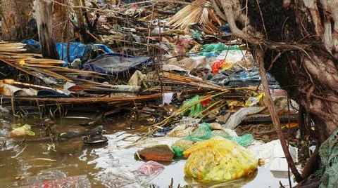 Earth Pollution Garbage Spread Into The River Stock Photos