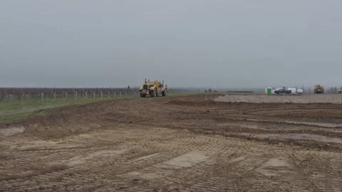 Earth scraper working on rural construction site. Stock Footage 342669538