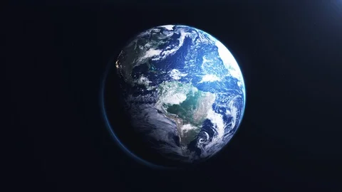 Earth slowly rotating in space moving from night to daylight loop. Stock Footage 129686260