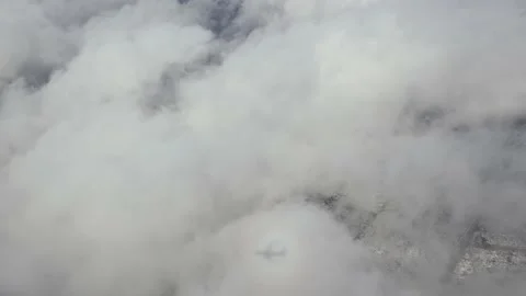 Earth through clouds. Aerial view. Cloud cover landscape: forest, roads Stock Footage 236657354