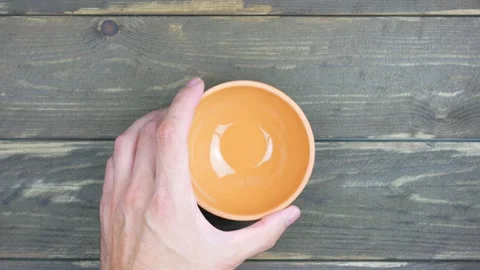 Earthenware bowl on a dark table Stock-Footage 138831722