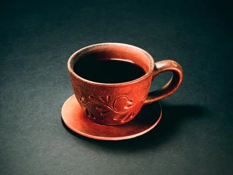 The earthenware cup of coffee. Close up Stock Photos