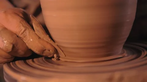 Earthenware jug in the making. hands of the master at work. clay trimming Stock Footage 133079097