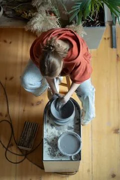 Earthenware making process on potters wheel raw clay by sculptor. From Interest Stock Photos