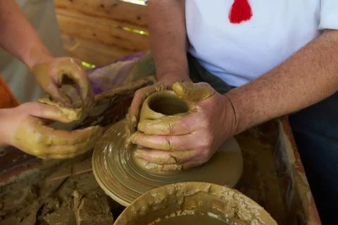 An earthenware pot has been made on the throwing wheel Stock Photos