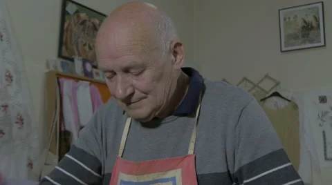 Earthenware. Pottery. Old man with hands making dish of clay,close up,tilt down. Stock Footage 57631440
