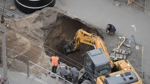 Earthmoving, excavator digging a deep hole in the ground. Stock Footage 127077380