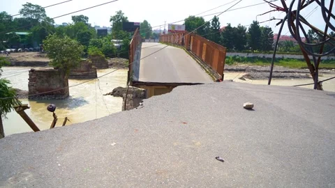 Earthquake shaking causing road split Stock Footage 321040886