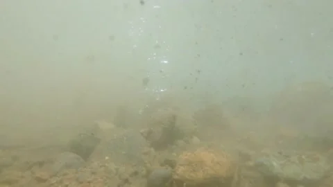 Earthquake-like shot under river falling rocks slow speed Stock Footage 152442980