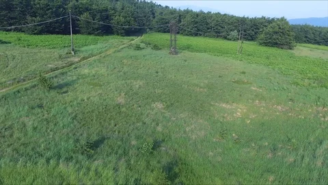 Earth's path leading to the forest and power lines Vídeo Stock 111376209
